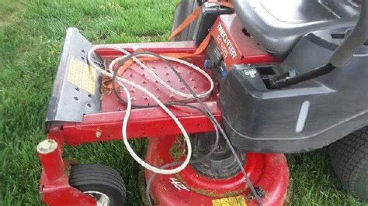 How do you adjust the steering on a lawn mower